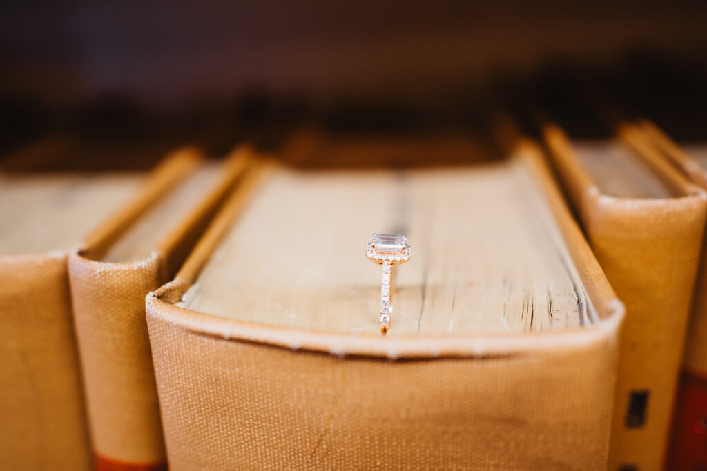 Engagement ring photo with old vintage book