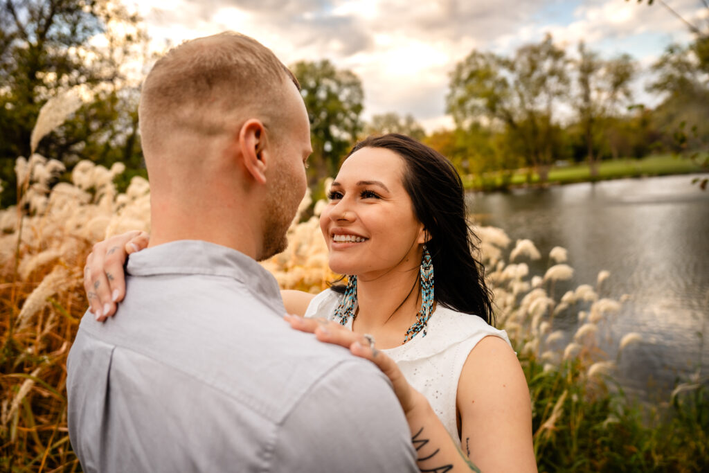 Engagement photo during fall next to a field Mason City Iowa