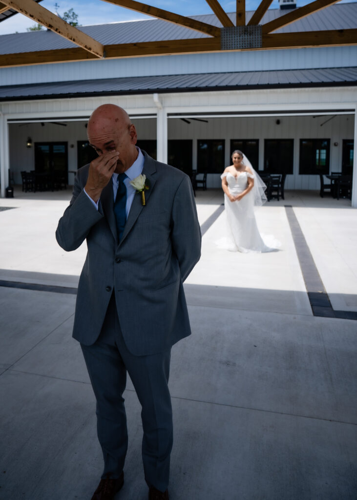 First look with dad at Bluebird Hill Iowa wedding venue
