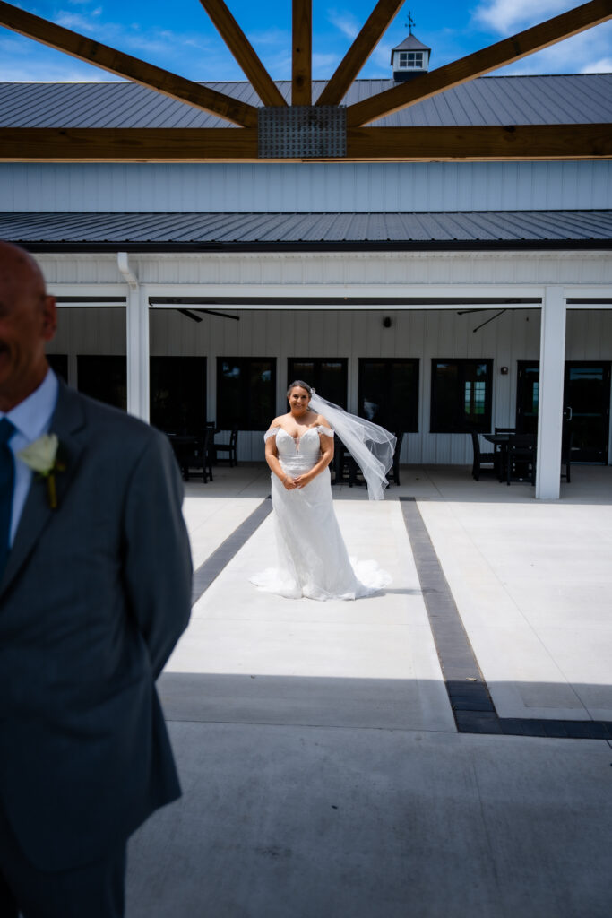 First look with dad at Bluebird Hill Iowa wedding venue