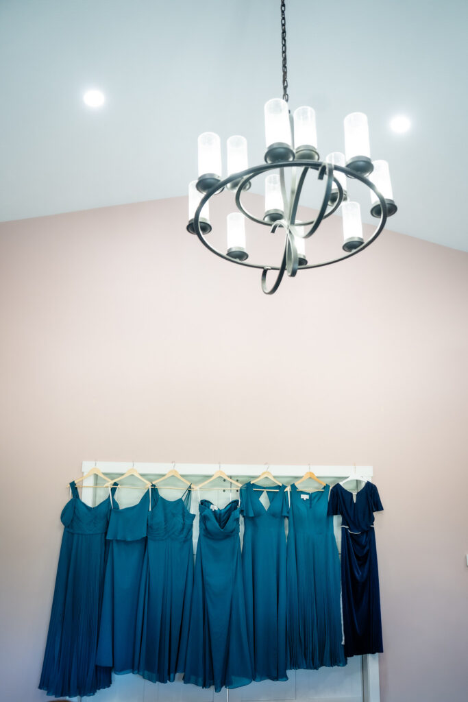 Dresses hanging up before the wedding at Bluebird Hill Iowa wedding venue