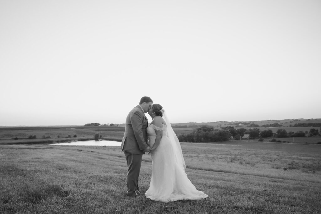Sunset couples photos at Bluebird Hill Iowa wedding venue
