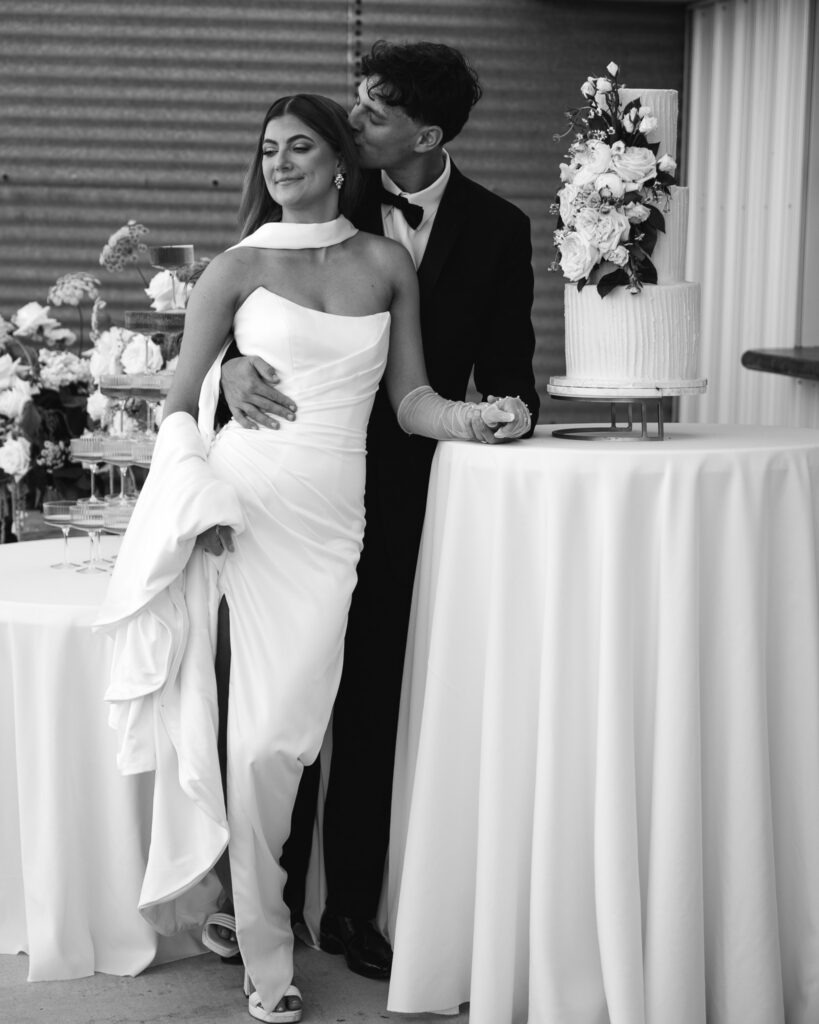 Black and white photo of a bride and groom in their wedding day at 1868 Farmhouse Iowa wedding venue