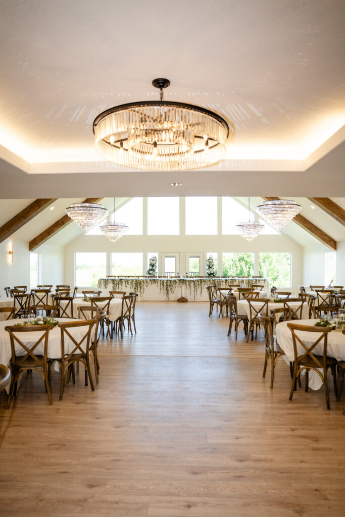 Reception space with huge chandeliers at Iowa wedding venue at The Vineyard at St. Charles